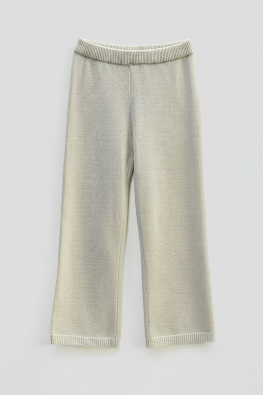 Cleaned beige knitted pants with off-white background
