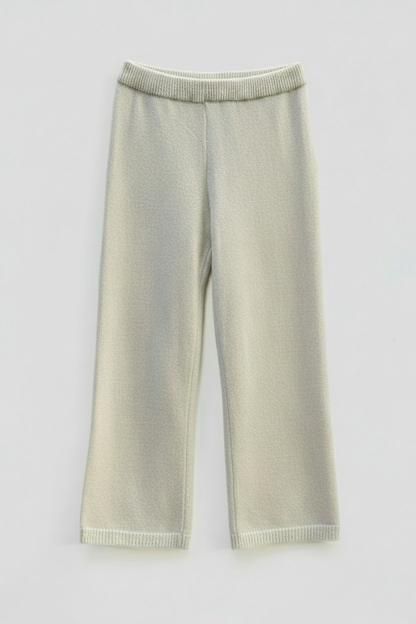 Beige knitted pants with studio lighting