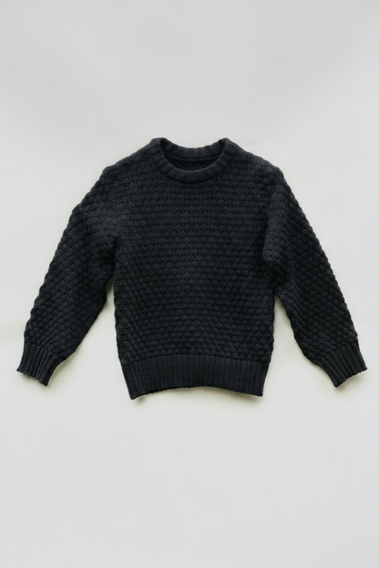 Black sweater with solid background