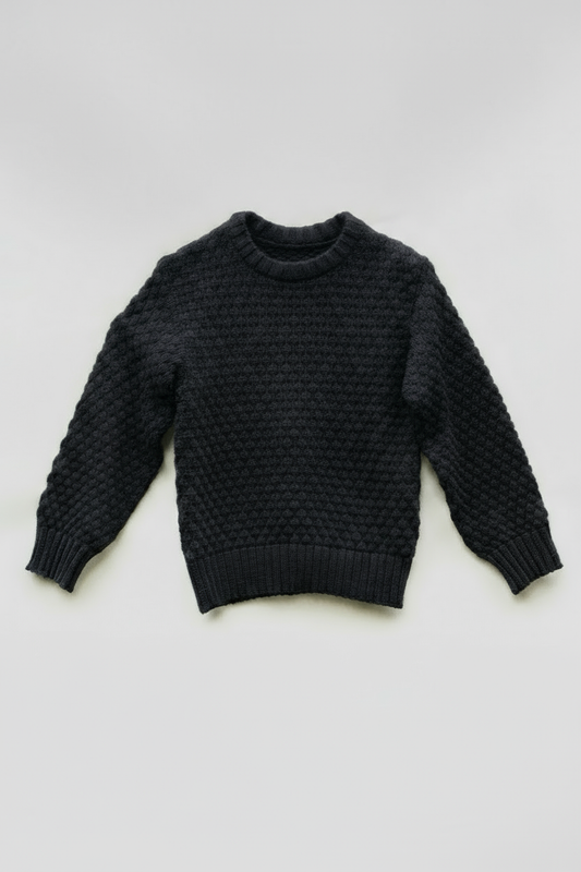 Black sweater with solid background