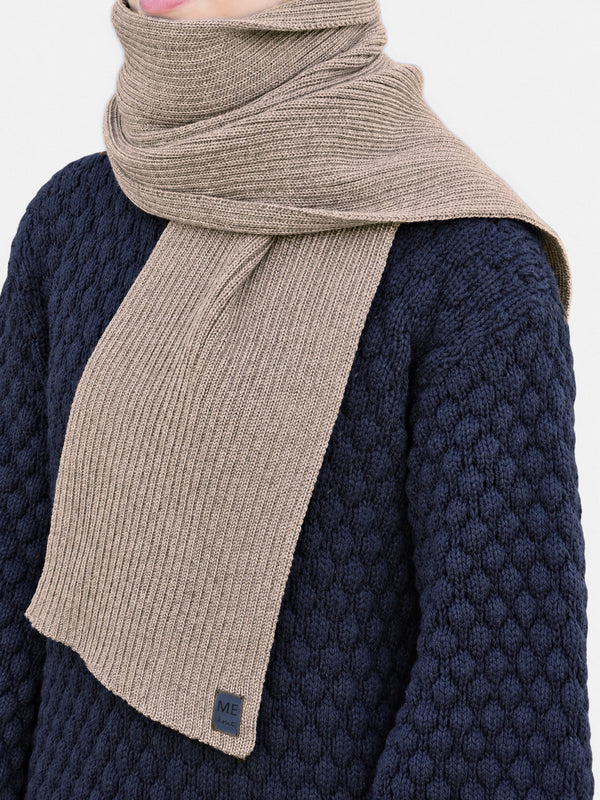 Soonik Scarf, beige – rib-knit merino wool scarf on a model